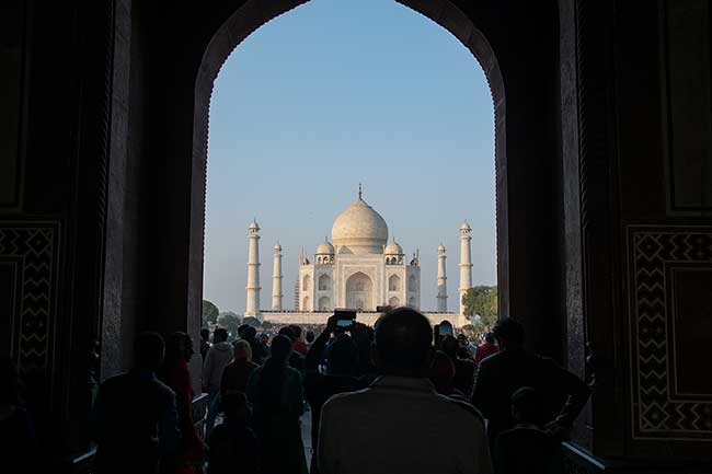 Entrance to Taj Mahal, packed with people.