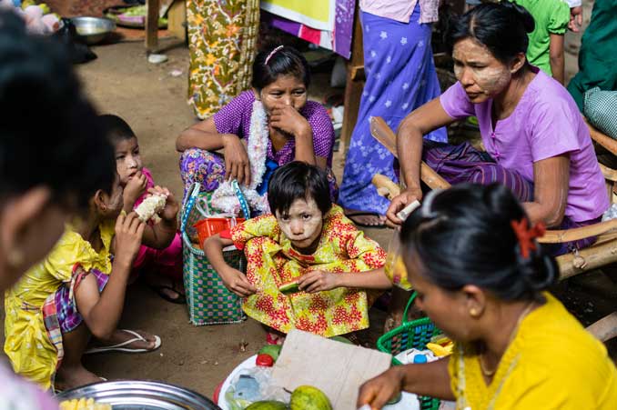 Group of people enjoying a meal at the market in Bagan.