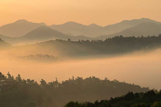 Layers of mountains and fog.