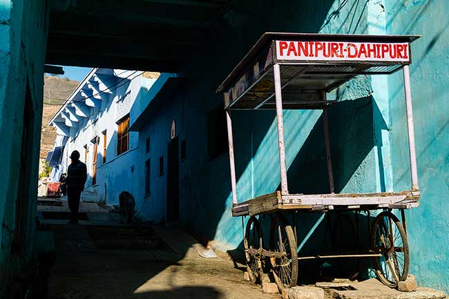 Food cart in alleyway.