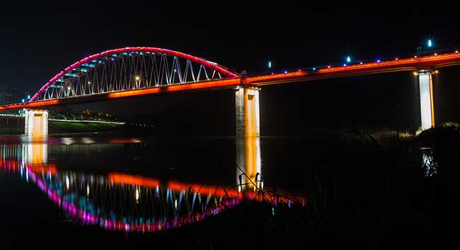 Reflection of LED lit bridge.