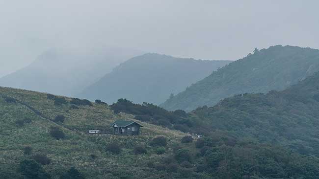 Small building in haze.