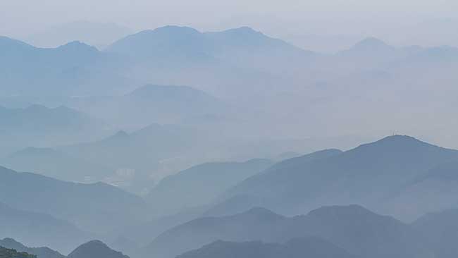 Blue layers of mountains.