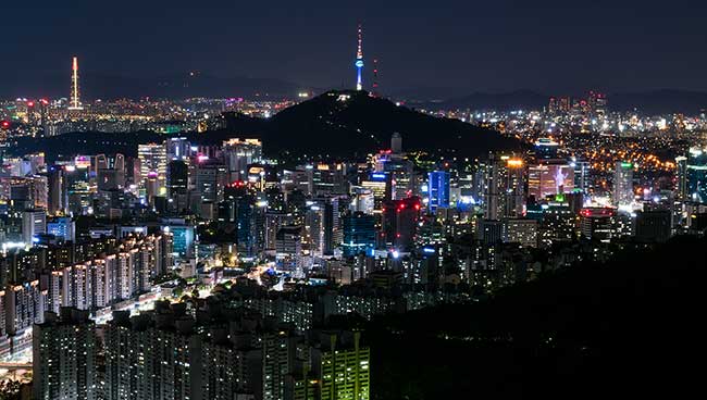 Namsan Tower and Seoul city at night.